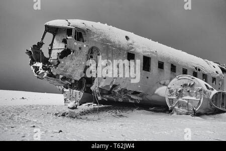 VIK, ICELAND - FEBRUARY 15, 2019: Wreck of the crashed DC 3 plane, covered by snow on a winter day on February 15, 2019 in Vik, Iceland Stock Photo