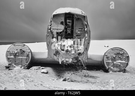 VIK, ICELAND - FEBRUARY 15, 2019: Wreck of the crashed DC 3 plane, covered by snow on a winter day on February 15, 2019 in Vik, Iceland Stock Photo