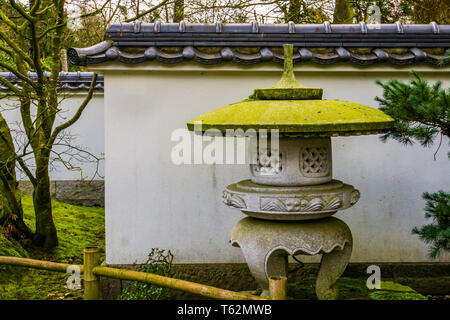 japanese stone tower in a Asian garden, Traditional garden architecture Stock Photo