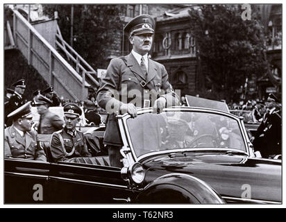 Archive 1930's Adolf Hitler in an open top Mercedes-Benz 770K Gross Open Tourer motorcar during a parade in Nurembeg Germany September 5th 1938 Stock Photo