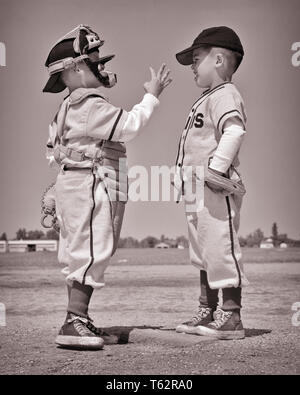 1960s Two Boys Brothers Wearing Little League Baseball Uniforms, Walking Arm in Arm | Large Solid-Faced Canvas Wall Art Print | Great Big Canvas