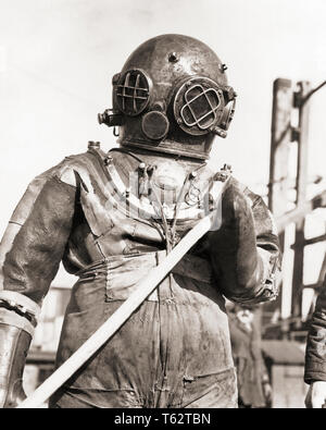 Vintage diver deep sea suit isolated on white Stock Photo - Alamy