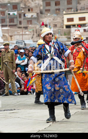 LEH, INDIA - SEPTEMBER 08, 2012: Man in traditional Tibetan clothes performing folk dance.  Annual Festival of Ladakh Heritage in Leh, India. Septembe Stock Photo
