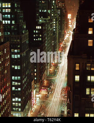 1970s NIGHT SHOT LOOKING NORTH ON 7TH AVENUE FROM STATLER HILTON ROOF NOW THE HOTEL PENNSYLVANIA - kr8110 RSS001 HARS PROPERTY EXTERIOR GOTHAM NORTHEAST TRAVEL USA NYC REAL ESTATE 7TH EAST COAST NEW YORK STRUCTURES CITIES TRAVEL NEW YORK CITY EDIFICE NEW YORK CITY OVERLOOKING RESORTS AERIAL VIEW BIG APPLE OLD FASHIONED Stock Photo
