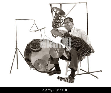 1930s ONE-MAN-BAND PLAYING ACCORDION FRENCH HORN DRUMS - m3415 RCH001 HARS SATISFACTION ACTOR MUSICIAN CELEBRATION BLOW EVENT COPY SPACE FULL-LENGTH TRIANGLE INSPIRATION ENTERTAINMENT CONFIDENCE AMERICANA B&W PERFORMING SUCCESS PERFORMING ARTS SINGULAR ACT SKILL ACCORDION WEIRD PERFORMER EXCITEMENT RECREATION STRESSFUL ZANY INNOVATION UNCONVENTIONAL DRUMSTICK OCCUPATIONS CYMBAL DRUMMER LONE PERFORM STYLISH IDIOSYNCRATIC MIDDLE AGE PLAYTHING RECITAL SKILLED ACCORDIONIST BOW TIE FUNNY PEOPLE MUSICAL EQUIPMENT AMUSING CREATIVITY ECCENTRIC MID-ADULT MID-ADULT MAN ONE MAN BAND SEVERAL SOLUTIONS Stock Photo