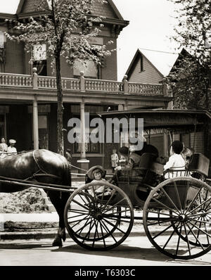 1890s 1900s GROUP OF BOYS AND GIRLS SITTING IN SURREY WITH FRINGE ON TOP CARRIAGE IN FRONT OF TURN OF THE 20TH CENTURY HOUSE - q74728 CPC001 HARS CELEBRATION BUGGY HOME LIFE LUXURY TRANSPORT HALF-LENGTH PERSONS RESIDENTIAL TRANSPORTATION B&W CARRIAGE HAPPINESS MAMMALS HEAD AND SHOULDERS FRINGE TURN OF THE 20TH CENTURY EXCITEMENT HORSE-DRAWN MOBILITY STYLISH EQUINE HORSE DRAWN CREATURE MAMMAL RELAXATION TOGETHERNESS ANIMALS HORSES BLACK AND WHITE OLD FASHIONED Stock Photo