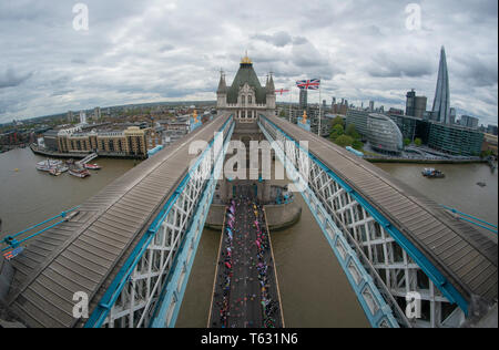 A view of the runners of the mass event from Tower Bridge during the 2019 Virgin Money London Marathon. Stock Photo