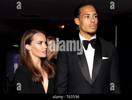 Rike Nooitgedagt (left) and Liverpool's Virgil van Dijk during the 2019 PFA Awards at the Grosvenor House Hotel, London. Stock Photo
