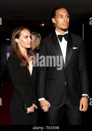 Rike Nooitgedagt (left) and Liverpool's Virgil van Dijk during the 2019 PFA Awards at the Grosvenor House Hotel, London. Stock Photo