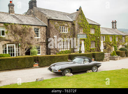 1966 classic Jaguar E type car parked outside an English country hotel in Nidderdale in the Yorkshire Dales England UK Stock Photo