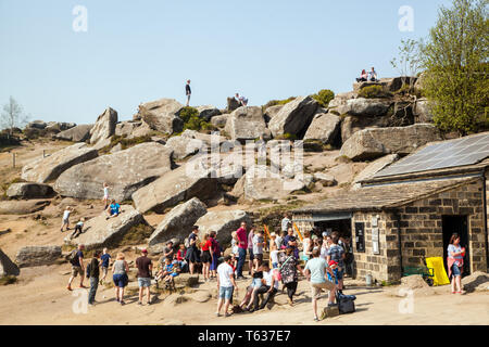 Families men women and children enjoying the day out at Brimham rocks a National Trust location in Nidderdale in the Yorkshire Dales England UK Stock Photo