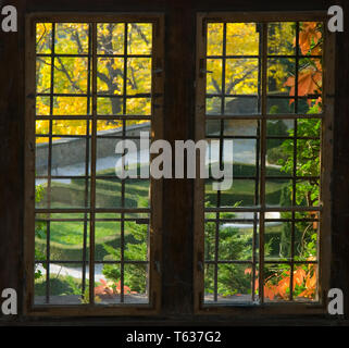 Ksiaz castle - looking at the garden in autumn, through a window Stock Photo
