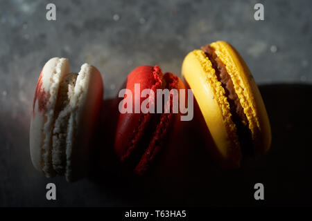 Macarons on a metallic background Stock Photo