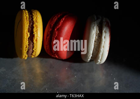 Macarons on a metallic background Stock Photo