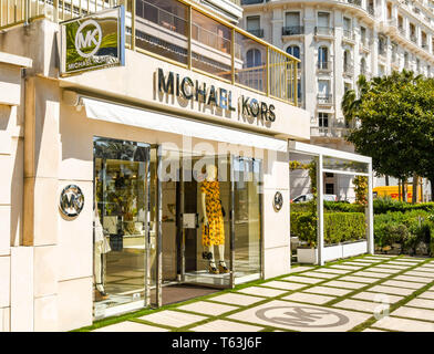 CANNES, FRANCE - APRIL 2019: Front of the Michael Kors store on the seafront in Cannes. It is a well known brand of designer goods. Stock Photo
