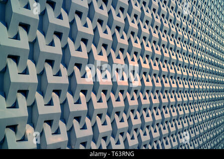 Diminishing perspective of a building 3D decorative pattern metallic grey outer wall Stock Photo