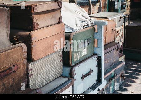 Sheringham, UK - April 21, 2019: Retro decorative suitcases on the platform of Sheringham train station on a sunny spring day. Sheringham is an Englis Stock Photo