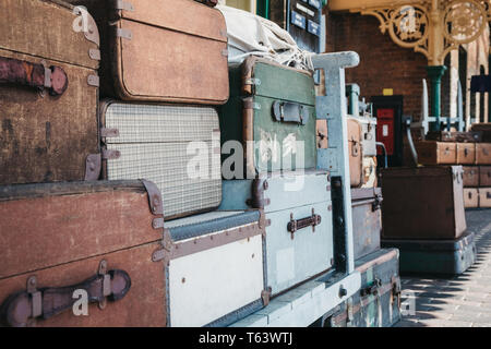 Sheringham, UK - April 21, 2019: Retro decorative suitcases on the platform of Sheringham train station on a sunny spring day. Sheringham is an Englis Stock Photo