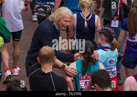 Sir Richard Branson at finish of the 2019 Virgin Money London Marathon, over 40,000 runners took part in the marathon in London this weekend. Stock Photo