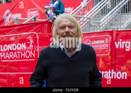 Sir Richard Branson at finish of the 2019 Virgin Money London Marathon, over 40,000 runners took part in the marathon in London this weekend. Stock Photo