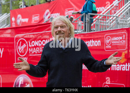 Sir Richard Branson at finish of the 2019 Virgin Money London Marathon, over 40,000 runners took part in the marathon in London this weekend. Stock Photo