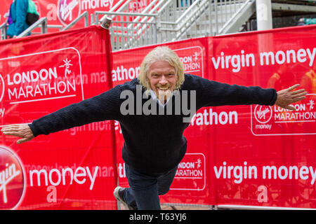 Sir Richard Branson at finish of the 2019 Virgin Money London Marathon, over 40,000 runners took part in the marathon in London this weekend. Stock Photo