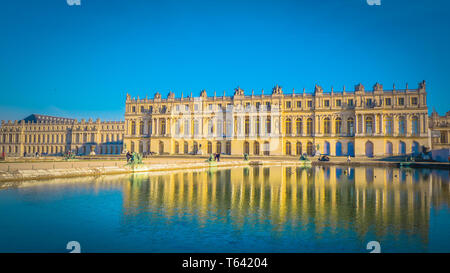 Famous palace Versailles with beautiful gardens outdoors near Paris, France. The Palace Versailles was a royal chateau and was added to the UNESCO. Stock Photo