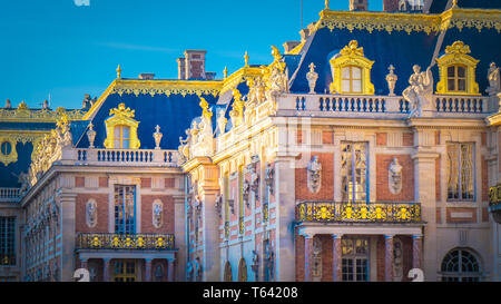 Famous palace Versailles with beautiful gardens outdoors near Paris, France. The Palace Versailles was a royal chateau and was added to the UNESCO Stock Photo