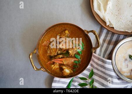 Kerala Spicy Crab curry served with Appam Stock Photo