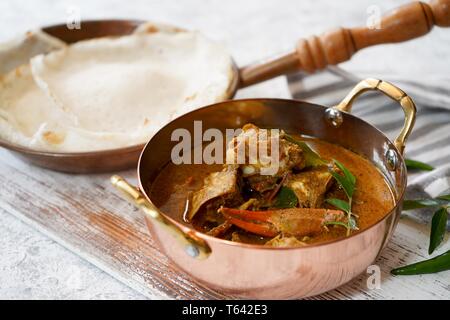 Kerala Spicy Crab curry served with Appam Stock Photo