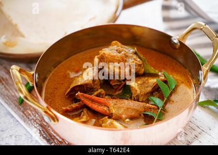 Kerala Spicy Crab curry served with Appam Stock Photo