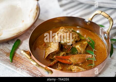 Kerala Spicy Crab curry served with Appam Stock Photo