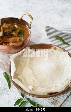 Kerala Appam and crab curry, selective focus Stock Photo