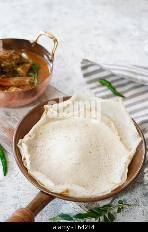 Kerala Appam and crab curry, selective focus Stock Photo