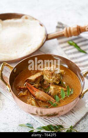 Kerala Spicy Crab curry served with Appam Stock Photo