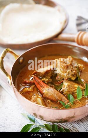 Kerala Spicy Crab curry served with Appam Stock Photo