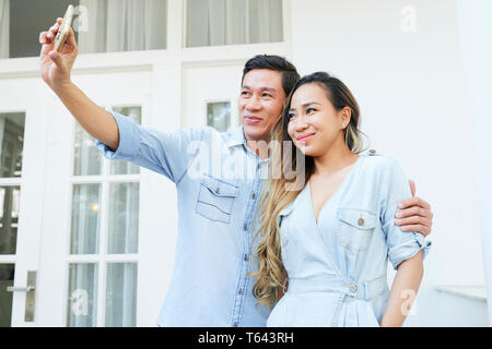 Happy couple taking selfie Stock Photo