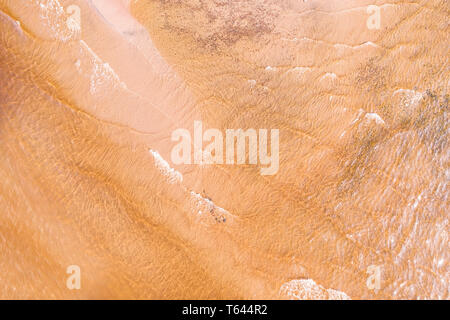 Shallow water with yellow sand bottom aerial view. Natural texture and background Stock Photo