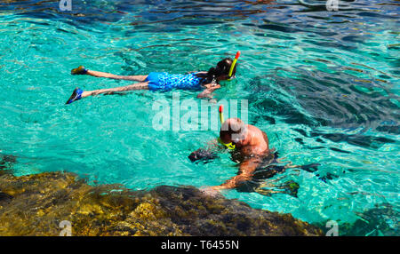 Naked woman swimming and diving in the Mediterranean Sea off the coast