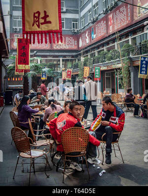Beijing, China. 18th Oct, 2006. People eating in the food court of the Donghuamen Night Market in Beijing. Credit: Arnold Drapkin/ZUMA Wire/Alamy Live News