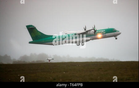 Cork Airport, Cork, Ireland. 29th Apr, 2019. An Aer Lingus Regional ATR 72 aircraft operated by Stobart Air takes off for Edinburgh from runway 16-34 on a very foggy morning at Cork Airport, Cork, Ireland. Credit: David Creedon/Alamy Live News Stock Photo