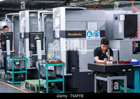Beijing, China's Guangdong Province. 22nd Feb, 2019. Workers are seen at a workshop in Longhua science and technology park of Foxconn Technology Group in Shenzhen, south China's Guangdong Province, Feb. 22, 2019. Credit: Mao Siqian/Xinhua/Alamy Live News Stock Photo