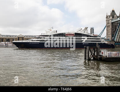 London, UK. 29th Apr, 2019. Le Champlain cruise ship passes under Tower Bridge in London.Le Champlain is the second ship of the Ponant Explorers-class of cruise ships operated by Ponant. Each member of the class has been allocated the name of a famous French explorer, and Le Champlain is named after Samuel de Champlain, 'The Father of New France”. Credit: Keith Larby/Alamy Live News Stock Photo