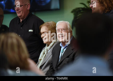 Plains, Georgia, USA. 28th Apr 2019. Former U.S. President Jimmy Carter and his wife, Rosalynn Carter, pose for a photograph with church attendees at Maranatha Baptist Church after Carter taught Sunday school in his hometown of Plains, Georgia on April 28, 2019. Carter, 94, has taught Sunday school at the church on a regular basis since leaving the White House in 1981, drawing hundreds of visitors who arrive hours before the 10:00 am lesson in order to get a seat and have a photograph taken with the former President and former First Lady Rosalynn Carter. Credit: Paul Hennessy/Alamy Live News Stock Photo