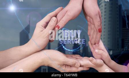 Men's, women's and children's hands show a hologram Buy service Stock Photo