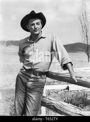 ROBERT MITCHUM candid portrait in THE RED PONY 1949 director Lewis Milestone novel and screenplay John Steinbeck Chas. K. Feldman Group Productions Inc. / Lewis Milestone Productions / Republic Pictures Stock Photo