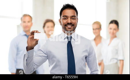indian businessman with business card at office Stock Photo