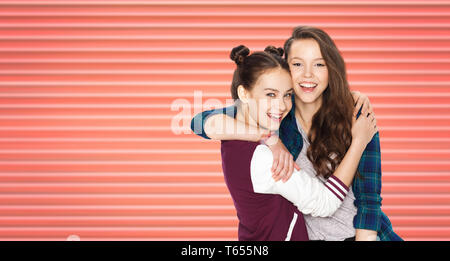 happy teenage girls or friends hugging Stock Photo