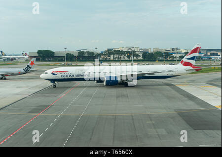 28.04.2019, Singapore, Republic of Singapore, Asia - A British Airways Boeing 777-300 ER passenger plane at Singapore's Changi Airport. Stock Photo