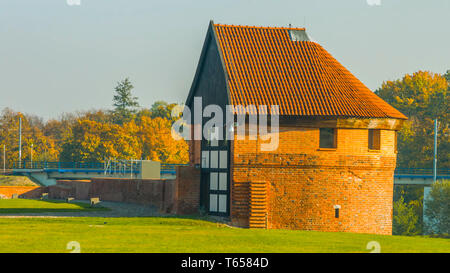 Red barn in the autumn - a barn overlooking a river Stock Photo